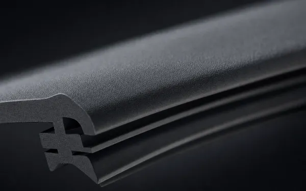 Close-up of a coated natural rubber wiper blade edge, dry